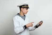 Sailor Holds A Compass