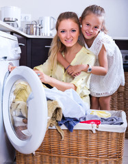 Wall Mural - Housewife and girl doing laundry