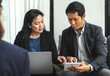 Business woman and man using tablet,notebook to planing work at corporate meeting in office,Business conference concept