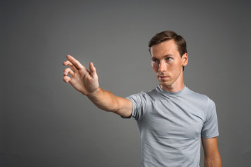 man working with transparent virtual interface screen.