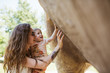 © Giordano Garosio - Mother and daughter touching model dinosaur in park