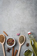 Fresh herbs and spices on gray stone table. Food background