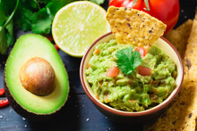 Guacamole With Ingredients And Tortilla Chips