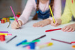 © pressmaster - Creative children drawing with multi-color pencils