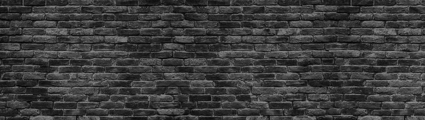 Wall Mural - black brick wall panoramic background for design