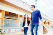© pressmaster - Father and daughter walking down shopping center and talking