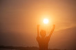 © Chittakon - Woman hands sunsets