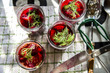 © Connect Images - Overhead view of beetroot and dill in preserves jars on tea towel