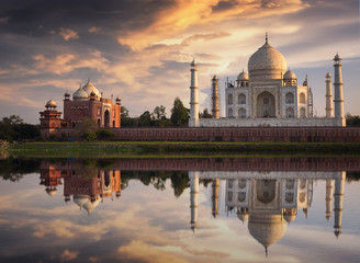 Fototapete - Taj Mahal at sunset as seen from Mehtab Bagh on the banks of the river Yamuna at Agra. Taj Mahal designated as a World Heritage Site is a masterpiece of Indian heritage and architecture.