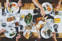 Top View Of Food Table, Happiness And Togetherness Concept, Group Of Hipsters Dinning Eating Homemade Food, Friends Celebrating Together At Restaurant
