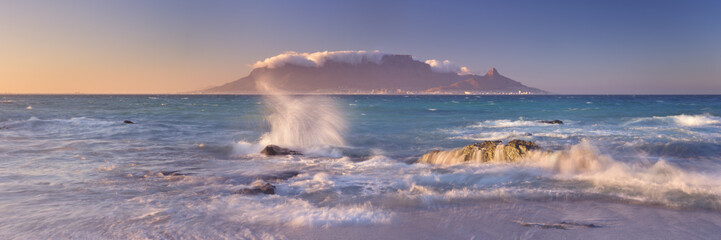 Wall Mural - Sunrise over Table Mountain and Cape Town from Blouwbergstrand