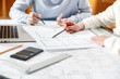 © Volodymyr Herasymov - Designers work on a blueprint of new apartments