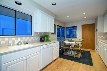 Wall Mural - White kitchen design with hardwood floor and white appliances