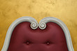 Headboard of empire-styled bed with decorative volutes
