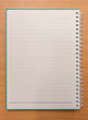 © CasanoWa Stutio - Notebook paper with on wooden background