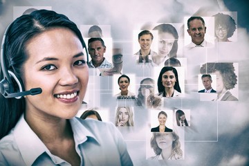 Poster - Composite image of smiling businesswoman using headset