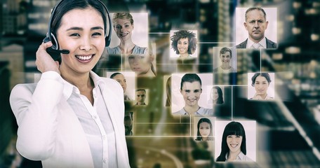 Poster - Composite image of smiling businesswoman using headset