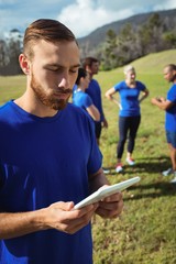 Wall Mural - Man using digital tablet in boot camp