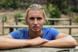 © WavebreakMediaMicro - Woman leaning on a hurdle during obstacle course
