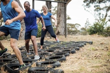 Wall Mural - People receiving tire obstacle course training