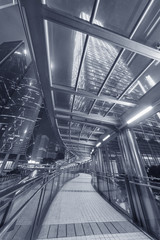 Poster - pedestrian walkway and skyscraper in Hong Kong city at night