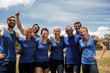 © WavebreakMediaMicro - Group of fit people posing together in boot camp