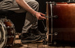 © puhimec - man adjusts percussion instruments, creative music concept