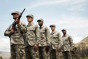 Wall Mural - Group of military soldiers standing in line