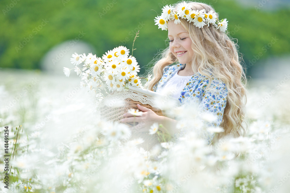 Beautiful little girl on nature with flowers Stock Photo | Adobe Stock