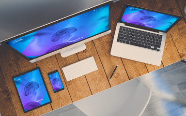 Sticker - top view workplace with devices showing responsive cool design website