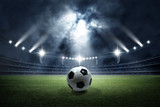 Fototapeta Sport - Soccer ball in the stadium