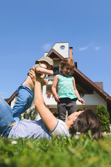 Wall Mural - Mother Holding Baby and Talking to Girl