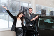 © aemstock - couple chooses the car in the showroom