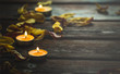 yellow candles and dried flower petals