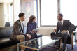 © Cavan Images - Married couple meeting with business professional