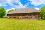 Fototapeta  - Old traditional wooden house in Tokarnia village on sunny spring day, Poland