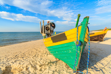 Wall Mural - Colorful fishing boats on sandy Debki beach during sunny summer day, Baltic Sea, Poland