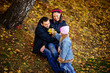 © cezarksv - Parents look at children in autumn park