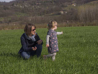 Mom and daughter in the meadow