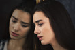 © Africa Studio - Depressed young woman and her reflection in mirror