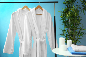 Wall Mural - Bathrobes hanging on rack at spa salon