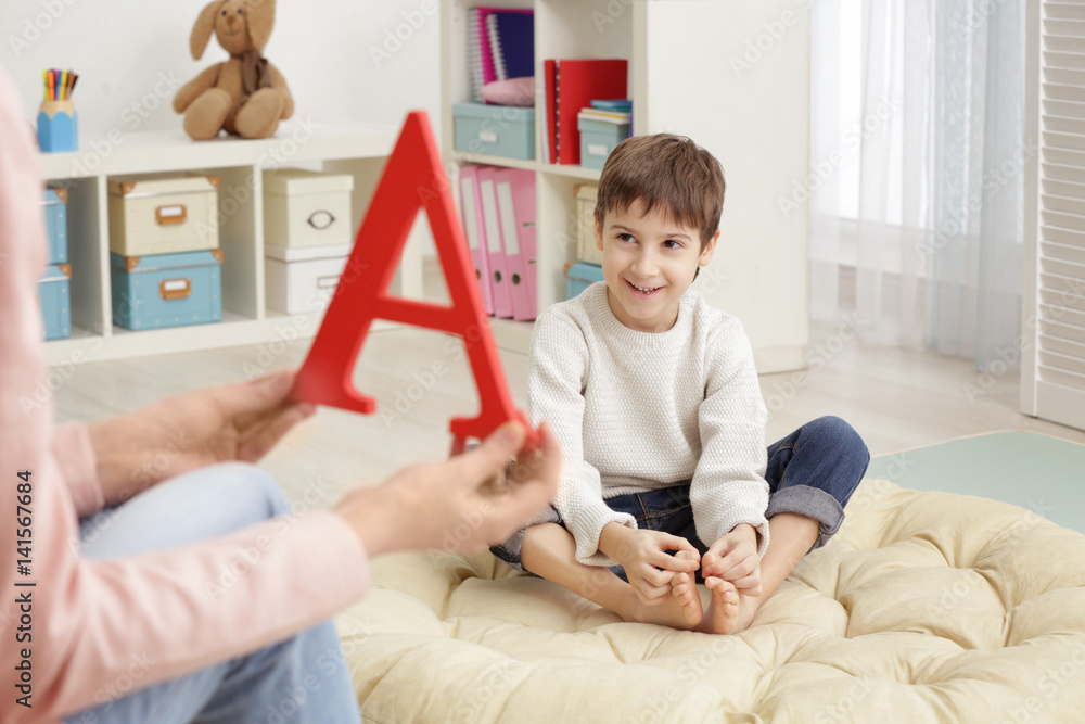 Cute little boy at speech therapist office