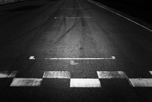 Start And Finish, Front Line Of Asphalt Street With Sign Of Start And Finish Line On Road, Black Abstract Texture And Background. 