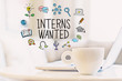 Interns Wanted concept with a cup of coffee