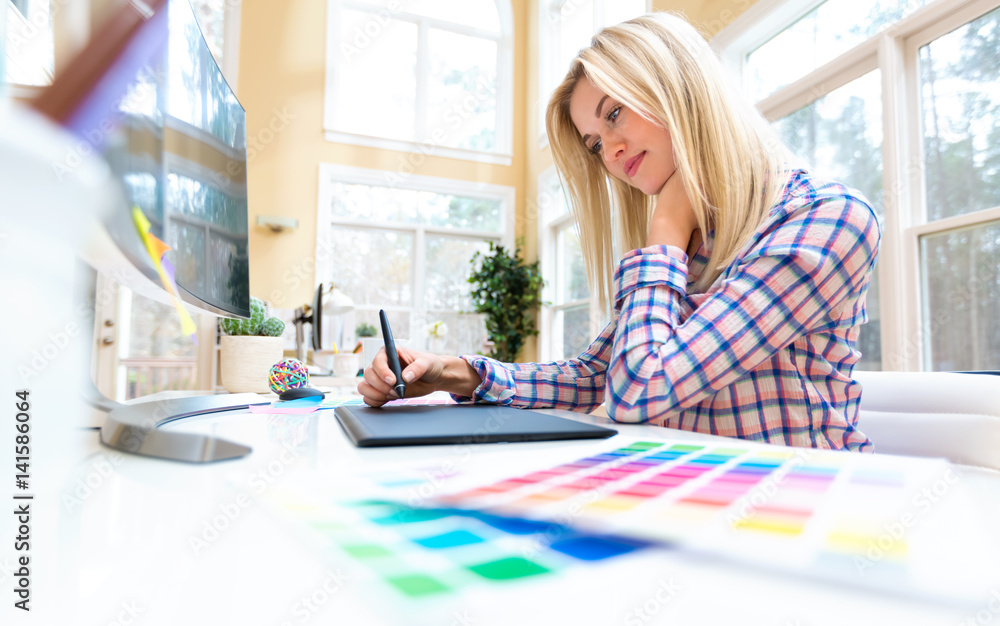Graphic designer using her graphic tablet Stock Photo | Adobe Stock