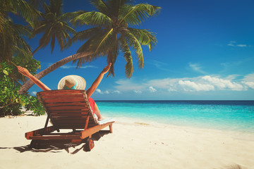 happy woman on tropical beach vacation