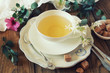 Romantic tea drinking with jasmine tea. Toned image