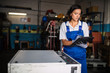 © ADDICTIVE STOCK - female mechanic checking machine status