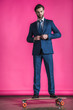 © LIGHTFIELD STUDIOS - man in suit with skateboard