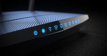 Wi-Fi Wireless Internet Router On Dark Background